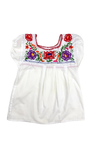 Vintage girls’ embroidered Mexican blouse with bright red, purple, pink, and orange flowers and green vines , featuring puffed sleeves with elasticized cuffs. The back of the shirt has a tiny purple flower.

The neckline and yoke are finished with a red blanket stitch.

The material feels like a cotton/poly blend.