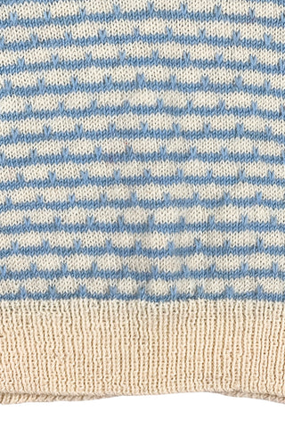 Vintage 1970s children’s wool sweater in white and blue ‘wave’ stripe. V-neck, with wide white collar, cuffs, and hem. Hand knit.