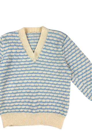 Vintage 1970s children’s wool sweater in white and blue ‘wave’ stripe. V-neck, with wide white collar, cuffs, and hem. Hand knit.