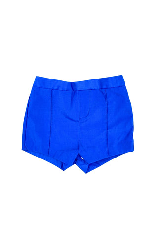 Vintage 1960s baby shorts with inner plastic diaper cover lining (which can easily be cut out, if you prefer). The shorts are made of a poly/cotton blend in bright royal blue, and features a faux fly placket on the front, and pin tucks down the legs. The waist is elasticized.

Marked size 12 months. Made in the Philippines.