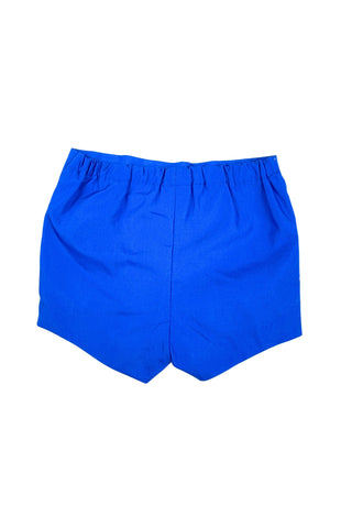 Vintage 1960s baby shorts with inner plastic diaper cover lining (which can easily be cut out, if you prefer). The shorts are made of a poly/cotton blend in bright royal blue, and features a faux fly placket on the front, and pin tucks down the legs. The waist is elasticized.

Marked size 12 months. Made in the Philippines.
