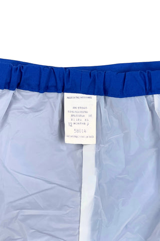 Vintage 1960s baby shorts with inner plastic diaper cover lining (which can easily be cut out, if you prefer). The shorts are made of a poly/cotton blend in bright royal blue, and features a faux fly placket on the front, and pin tucks down the legs. The waist is elasticized.

Marked size 12 months. Made in the Philippines.