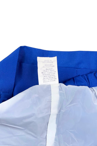 Vintage 1960s baby shorts with inner plastic diaper cover lining (which can easily be cut out, if you prefer). The shorts are made of a poly/cotton blend in bright royal blue, and features a faux fly placket on the front, and pin tucks down the legs. The waist is elasticized.

Marked size 12 months. Made in the Philippines.