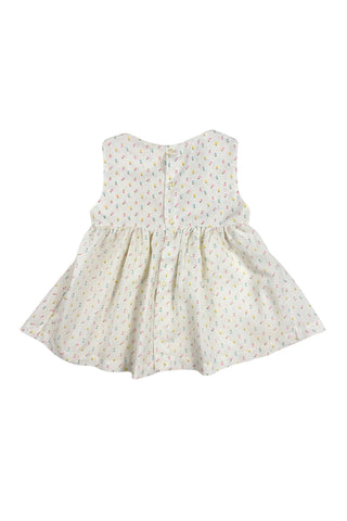 This vintage cotton baby dress is sleeveless and features smocking across the chest, and is accented with a small pink bow. The dress closes in the back with four ivory buttons.

Condition note: There is some light yellow general staining on the chest, but it is very subtle, and could likely be removed with stain treatment.