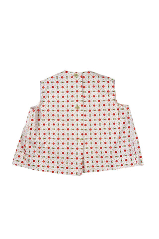 Vintage 1960s toddler girls’ white sleeveless dress featuring a red, yellow, and green floral pattern with white eyelet lace trim.

Made in Austria.