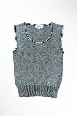 Vintage 1970s sweater vest in silver metallic knit, with black striped accents around the low, round collar and sleeveless arm openings.

Designed by The Kollection. Made in Canada.

Marked size Small.