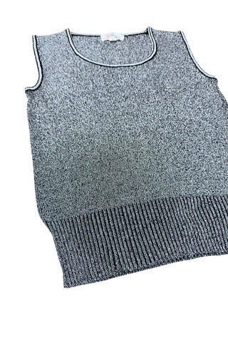 Vintage 1970s sweater vest in silver metallic knit, with black striped accents around the low, round collar and sleeveless arm openings.

Designed by The Kollection. Made in Canada.

Marked size Small.
