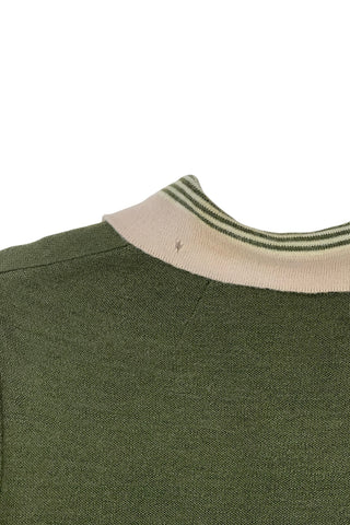 Vintage 1950s wool cardigan sweater in olive green and cream with three-quarter length sleeves. The sweater features a rolled collar with a striped design, with a matching striped band at the waist. Closes with six green lucite buttons.