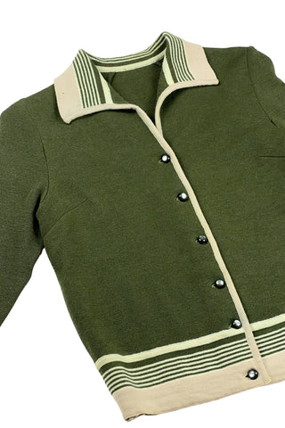 Vintage 1950s wool cardigan sweater in olive green and cream with three-quarter length sleeves. The sweater features a rolled collar with a striped design, with a matching striped band at the waist. Closes with six green lucite buttons.