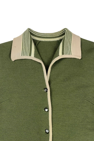 Vintage 1950s wool cardigan sweater in olive green and cream with three-quarter length sleeves. The sweater features a rolled collar with a striped design, with a matching striped band at the waist. Closes with six green lucite buttons.