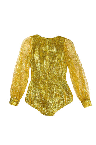 Vintage 1960s gold fringe bodysuit costume with long cuffed sheer lace sleeves and a sweetheart neckline. The hourglass cut of the non-stretch gold material keeps all your curves in place in a classic bombshell shape.

The costume closes in the back with a long cotton twill zipper. There is no opening at the bottom. The long sleeves close with hook and eye closures instead of buttons.