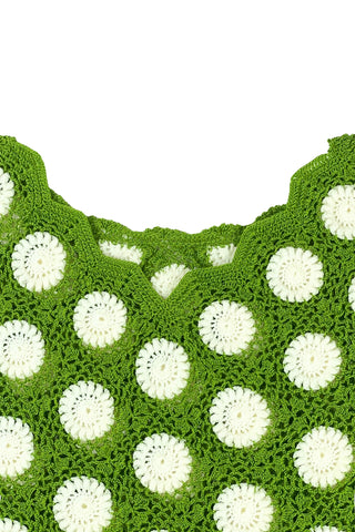 Vintage 1960s crochet sweater top in avocado green with white daisy polkadot pattern. The sweater features a scalloped V-neckline, short sleeves, and a scalloped, pointed hem.