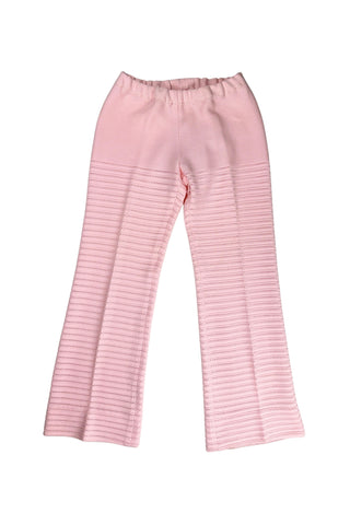 Vintage 1960s women’s trousers in light pink eyelet knit with creased seams and a slight flare at the hem. Elasticized waist.