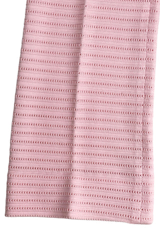 Vintage 1960s women’s trousers in light pink eyelet knit with creased seams and a slight flare at the hem. Elasticized waist.