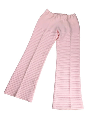 Vintage 1960s women’s trousers in light pink eyelet knit with creased seams and a slight flare at the hem. Elasticized waist.