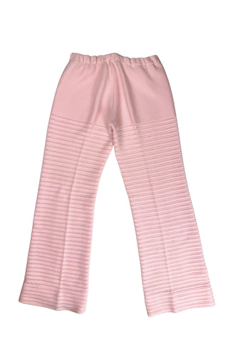 Vintage 1960s women’s trousers in light pink eyelet knit with creased seams and a slight flare at the hem. Elasticized waist.