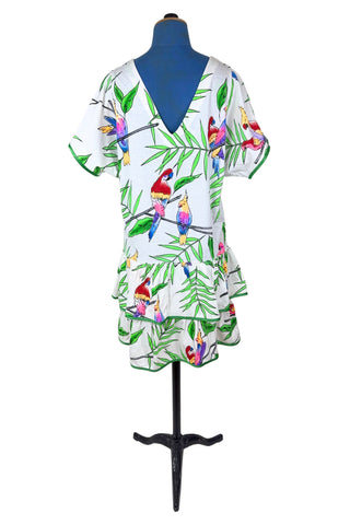 Vintage 1980s dress with tropical parrot and leaf print on soft, mid-weight cotton jersey. Slouchy fit with short sleeves and two-tiered ruffle skirt. The edges of the hem ruffles and sleeves are finished with lime green satin. Perfect for all your summer adventures!

Designed by Himalaya. Made in Hamburg.

Marked size medium.
