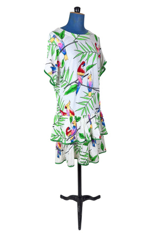 Vintage 1980s dress with tropical parrot and leaf print on soft, mid-weight cotton jersey. Slouchy fit with short sleeves and two-tiered ruffle skirt. The edges of the hem ruffles and sleeves are finished with lime green satin. Perfect for all your summer adventures!

Designed by Himalaya. Made in Hamburg.

Marked size medium.