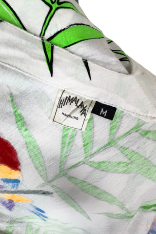 Vintage 1980s dress with tropical parrot and leaf print on soft, mid-weight cotton jersey. Slouchy fit with short sleeves and two-tiered ruffle skirt. The edges of the hem ruffles and sleeves are finished with lime green satin. Perfect for all your summer adventures!

Designed by Himalaya. Made in Hamburg.

Marked size medium.