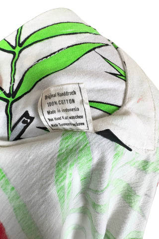 Vintage 1980s dress with tropical parrot and leaf print on soft, mid-weight cotton jersey. Slouchy fit with short sleeves and two-tiered ruffle skirt. The edges of the hem ruffles and sleeves are finished with lime green satin. Perfect for all your summer adventures!

Designed by Himalaya. Made in Hamburg.

Marked size medium.