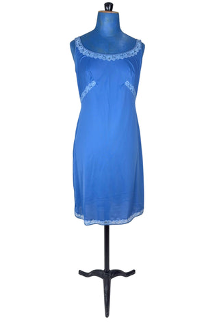 Vintage 1960s full slip in cornflower blue nylon with light blue inset lace at the collar, underbust, and hem.