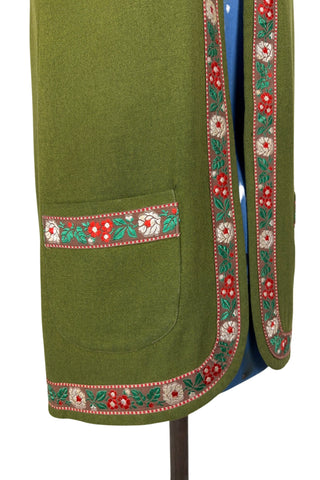 Vintage Trachten-style green wool folk vest featuring floral embroidery trim and a closing tab which fastens with a snap.