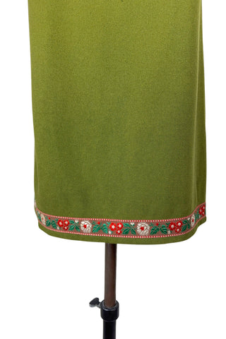 Vintage Trachten-style green wool folk vest featuring floral embroidery trim and a closing tab which fastens with a snap.