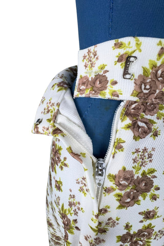 Vintage 1970s A-line skirt by White Stag with green and brown floral print. The skirt closes in the side with a Lightning zipper.