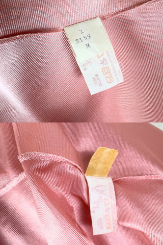 Vintage 1970s nightgown in light pink nylon jersey with wide white lace panel at the V-neckline.
By Claudel. Made in Canada.