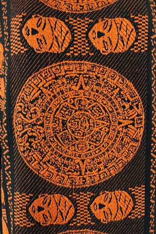 Vintage 1960s cotton shift dress with black and orange Aztec sun stone (calendar stone) woven motif. Straight, easy classic shift fit, with slight shaping from darts at the bust. The dress has no zipper or other closures, and is unlined.