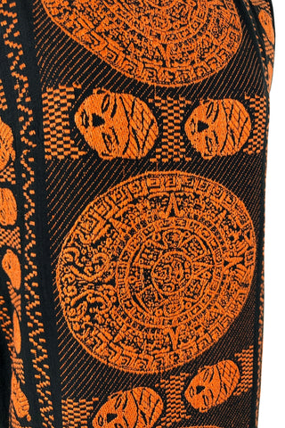 Vintage 1960s cotton shift dress with black and orange Aztec sun stone (calendar stone) woven motif. Straight, easy classic shift fit, with slight shaping from darts at the bust. The dress has no zipper or other closures, and is unlined.