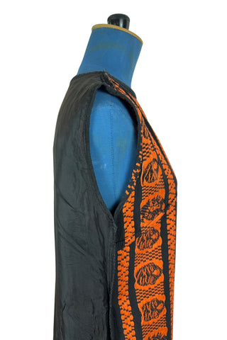 Vintage 1960s cotton shift dress with black and orange Aztec sun stone (calendar stone) woven motif. Straight, easy classic shift fit, with slight shaping from darts at the bust. The dress has no zipper or other closures, and is unlined.