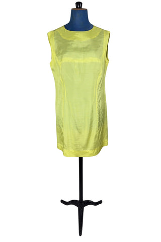 Vintage 1960s shift dress in sunny yellow rayon that resembles shot silk.  Sleeveless, with a round neckline. The dress closes in the back with a cotton twill zipper, and is unlined.