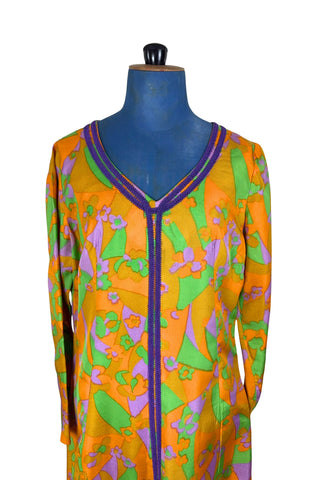 Vintage 1960s psychedelic print maxi dress in bright orange, green and purple abstract floral print, with purple soutache trim detail around the collar and down the front. The dress has long sleeves, and closes in the back with a metal zipper. 

Designed with an A-line silhouette which flares gently through the hips.