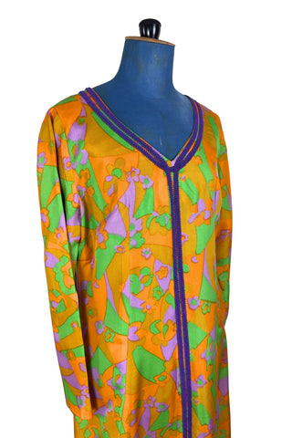 Vintage 1960s psychedelic print maxi dress in bright orange, green and purple abstract floral print, with purple soutache trim detail around the collar and down the front. The dress has long sleeves, and closes in the back with a metal zipper. 

Designed with an A-line silhouette which flares gently through the hips.