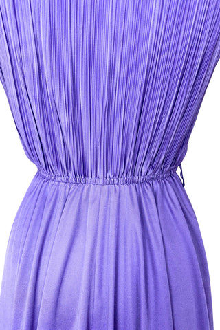 Vintage 1970s sleeveless dress in lilac purple with wrap style V neck bodice with accordion pleating. The waist is elasticized.