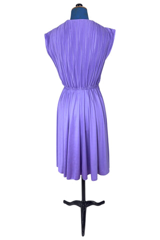 Vintage 1970s sleeveless dress in lilac purple with wrap style V neck bodice with accordion pleating. The waist is elasticized.