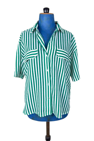 Vintage 1980s button down shirt with white and green stripes. Features short sleeves and wide faux-pocket flaps with button closures. Can be worn fully buttoned or with an open neckline for two distinct looks.

Designed by Carl B (Carl Backman Ent.). Made in Canada. 