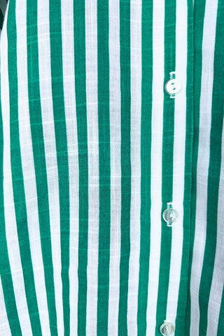 Vintage 1980s button down shirt with white and green stripes. Features short sleeves and wide faux-pocket flaps with button closures. Can be worn fully buttoned or with an open neckline for two distinct looks.

Designed by Carl B (Carl Backman Ent.). Made in Canada. 