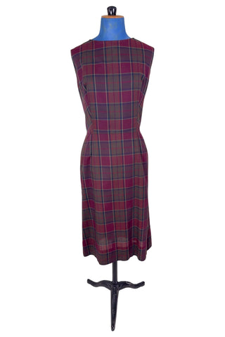 Vintage 1950s sleeveless day dress in dark red plaid cotton. The dress closes in the back with a metal zipper, and is unlined.

Designed by Henry-Lee. 