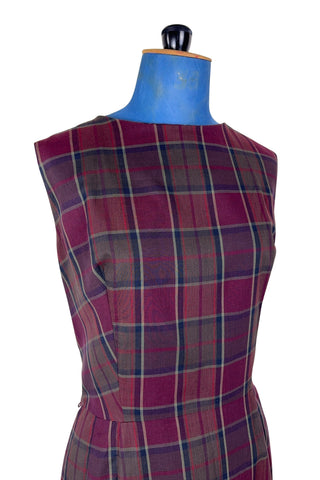 Vintage 1950s sleeveless day dress in dark red plaid cotton. The dress closes in the back with a metal zipper, and is unlined.

Designed by Henry-Lee. 