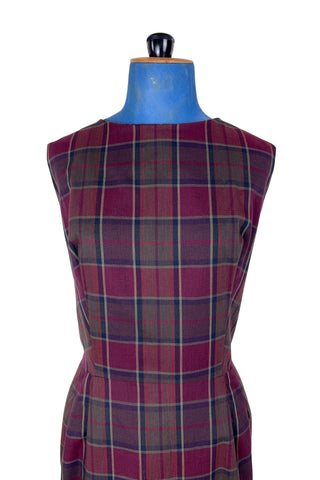 Vintage 1950s sleeveless day dress in dark red plaid cotton. The dress closes in the back with a metal zipper, and is unlined.

Designed by Henry-Lee. 