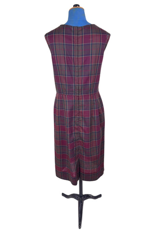 Vintage 1950s sleeveless day dress in dark red plaid cotton. The dress closes in the back with a metal zipper, and is unlined.

Designed by Henry-Lee. 