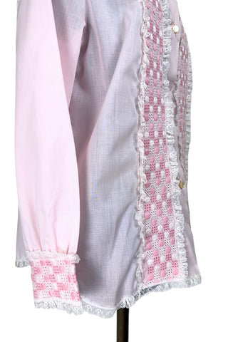 Vintage late 1950s pajama top shirt in light pink cotton with wide panels of eyelet embroidery down the front and at the sleeve cuffs. The high collar, sleeves, and hem are finished with tiny white ruffled lace.

Designed by Perri-Ann Lingerie in Montreal, Canada.