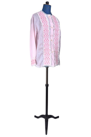 Vintage late 1950s pajama top shirt in light pink cotton with wide panels of eyelet embroidery down the front and at the sleeve cuffs. The high collar, sleeves, and hem are finished with tiny white ruffled lace.

Designed by Perri-Ann Lingerie in Montreal, Canada.