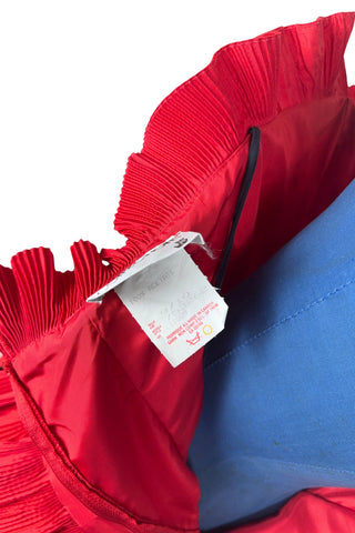 Vintage late 1980s or early 1990s cocktail dress in bold red acetate faille fabric with subtle ribbed texture. The strapless bodice has a wrapped appearance, trimmed with wide panels of accordion pleated ruffles. A large bow at the waist is crowned with a wide band of rhinestones.

Designed with an hourglass silhouette, the dress hugs and accentuates curves for a bombshell fit. 

Marked size 9/10 (vintage sizing - see measurements section at right).

Designed by Collections JS. Made in Canada.